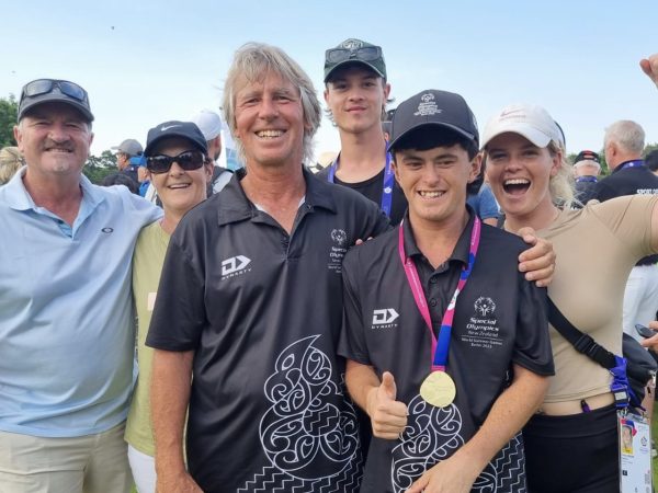 Surrounded by loved ones, Mitch Brown and his father Mike embrace whānau at the Berlin Special Olympics. Photo / Supplied
