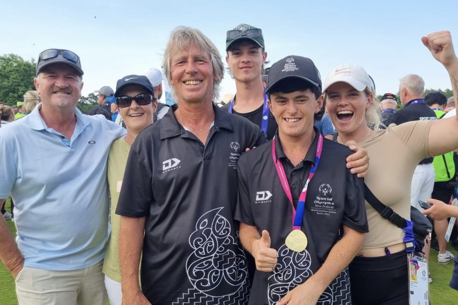 Surrounded by loved ones, Mitch Brown and his father Mike embrace whānau at the Berlin Special Olympics. Photo / Supplied