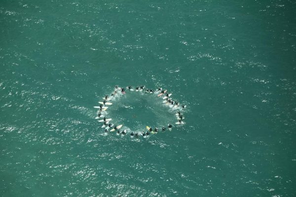 In a touching tribute, Aotea's surfers gathered at Medland's for a paddle out at 2 pm, as Mike's journey from the island took flight for the last time. Photo / Facebook