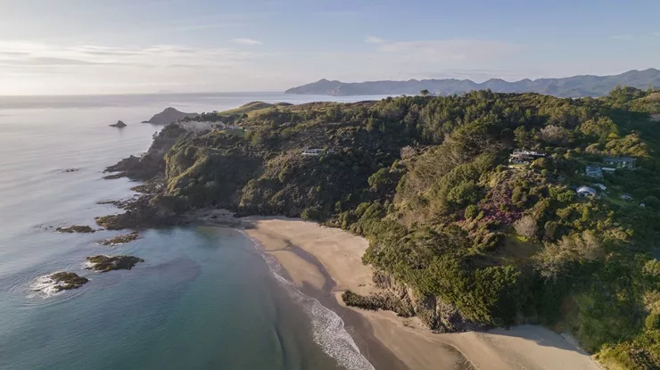 The bach overlooks one of New Zealand's best white sand surf beaches. Photo / Supplied