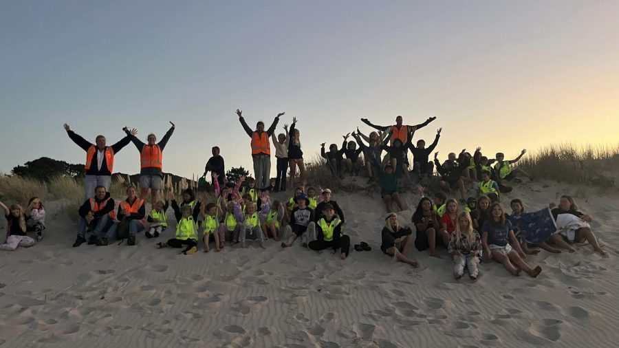 Ākonga ready on Kaitoke Beach to catch the sunset, kicking off a week of stargazing adventures. Photo / Kaitoke School