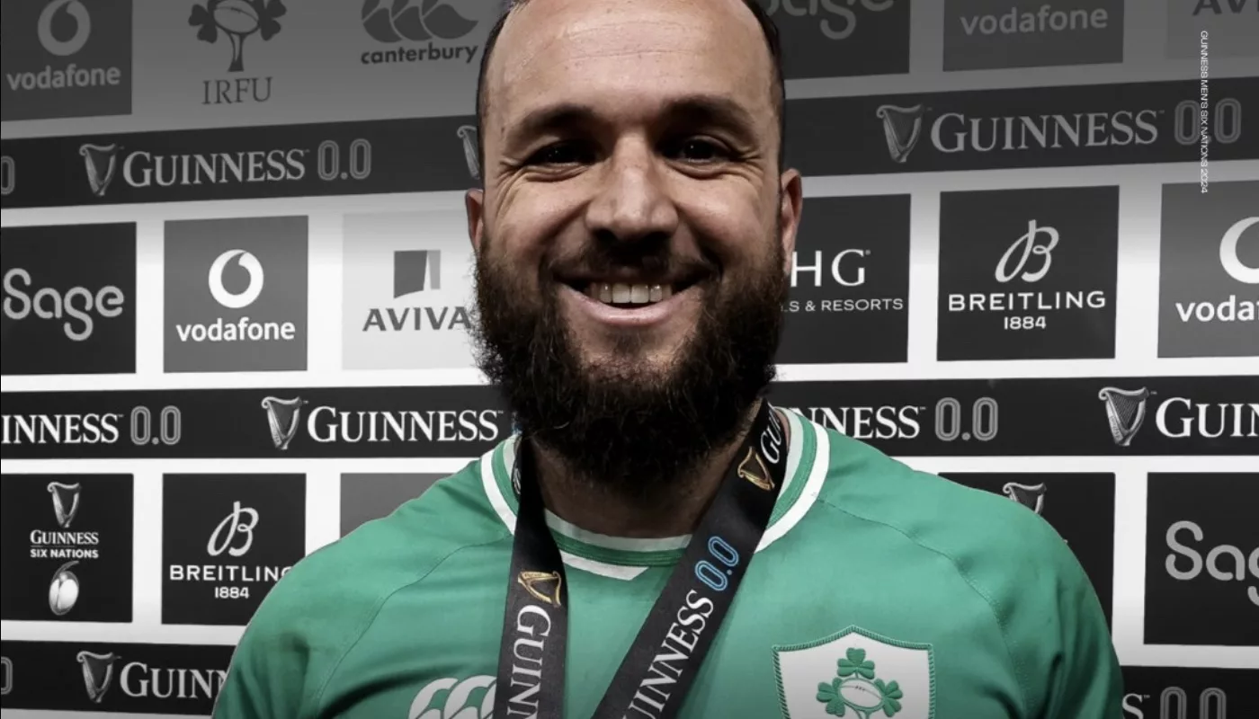 Jamison Gibson-Park beams with pride, wearing his medal after guiding Ireland to a victorious Six Nations on St. Patrick's Day.
