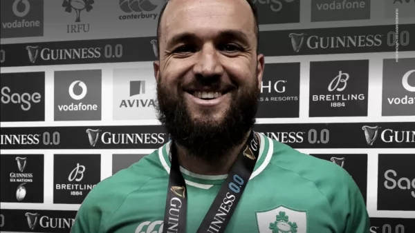 Jamison Gibson-Park beams with pride, wearing his medal after guiding Ireland to a victorious Six Nations on St. Patrick's Day.