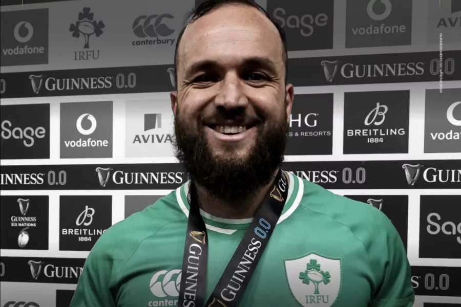 Jamison Gibson-Park beams with pride, wearing his medal after guiding Ireland to a victorious Six Nations on St. Patrick's Day.