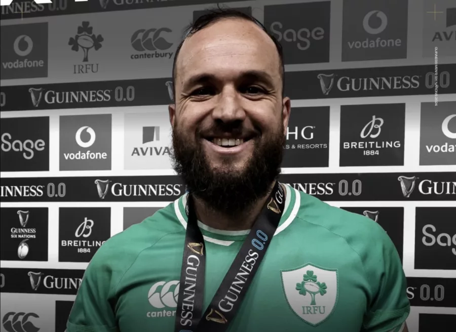 Jamison Gibson-Park beams with pride, wearing his medal after guiding Ireland to a victorious Six Nations on St. Patrick's Day.