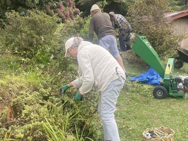 Aotea Army volunteers in action, transforming a garden with community spirit on Great Barrier Island. Photo / Aotea Army