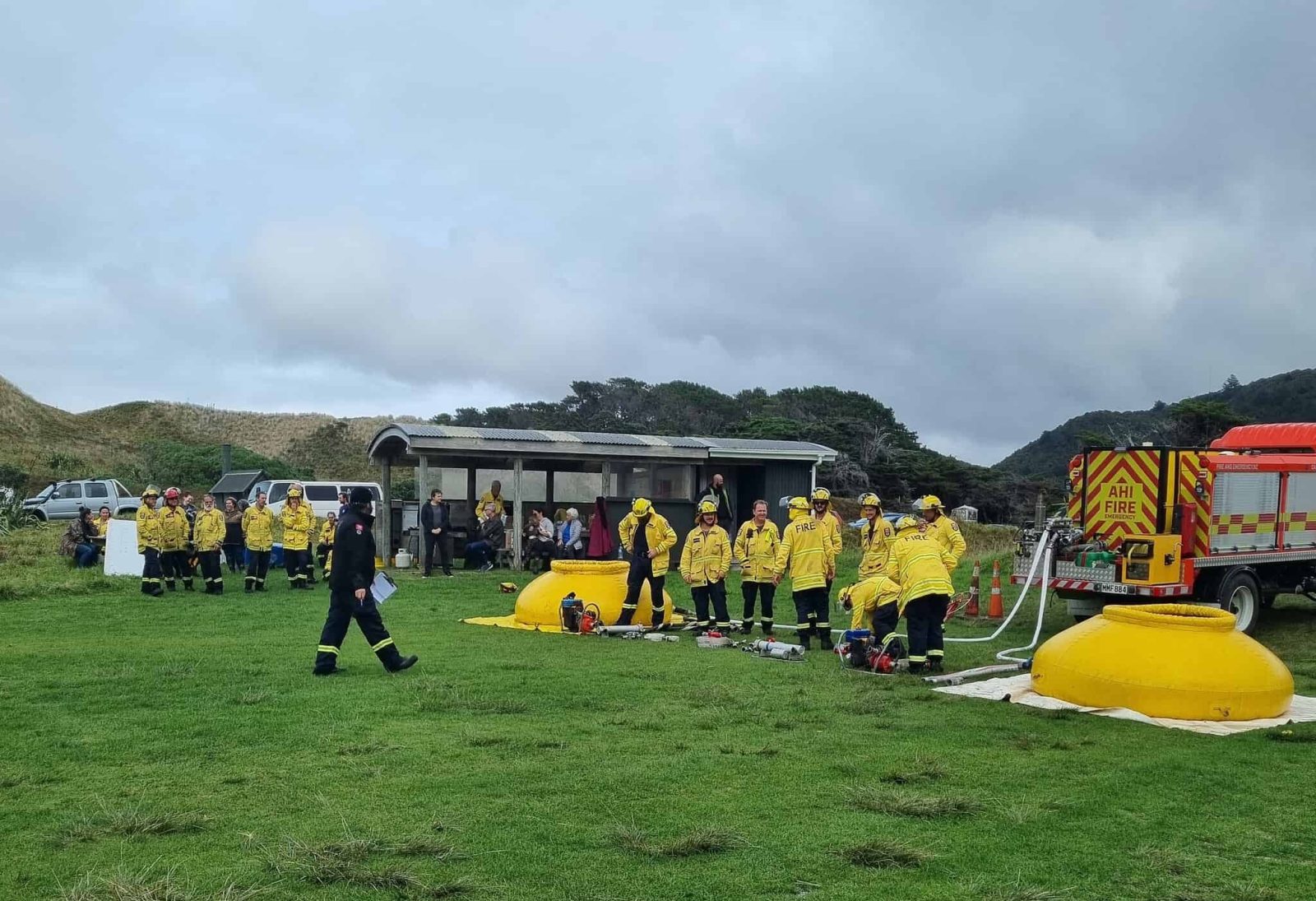 Great Barrier Island's firefighting crews battle the clock and each other in a fiery time trial. Photo / Leanne Sanderson via Barrier Bulletin