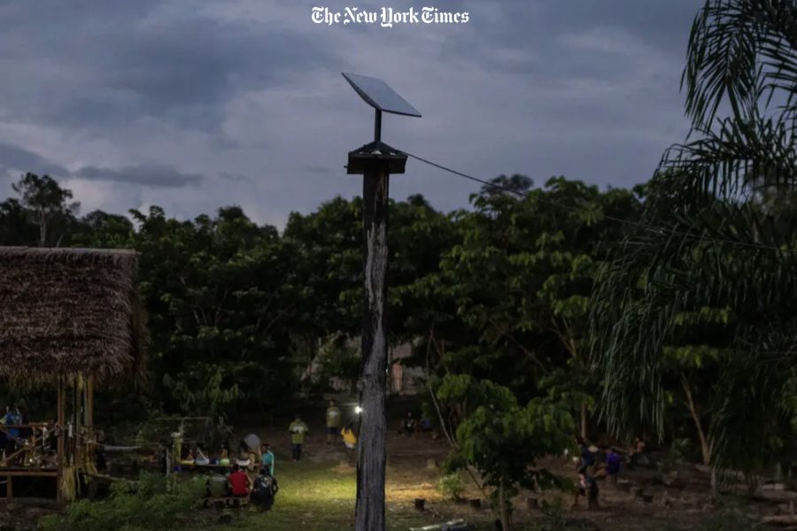 A Starlink antenna stands tall amidst the Marubo community, symbolizing the intersection of tradition and modernity as the tribe navigates the benefits and challenges of unfettered internet access. Photo / NYTimes