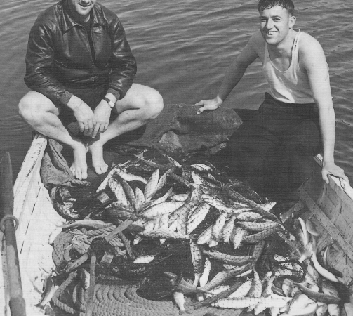 Two unidentified men with a remarkable fishing haul on Great Barrier Island, early 1900s. Can you identify them? Email editor@aoteagbi.news Photo / Supplied