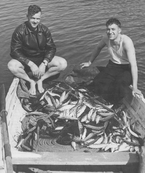 Two unidentified men with a remarkable fishing haul on Great Barrier Island, early 1900s. Can you identify them? Email editor@aoteagbi.news Photo / Supplied