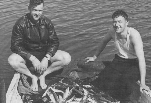 Two unidentified men with a remarkable fishing haul on Great Barrier Island, early 1900s. Can you identify them? Email editor@aoteagbi.news Photo / Supplied