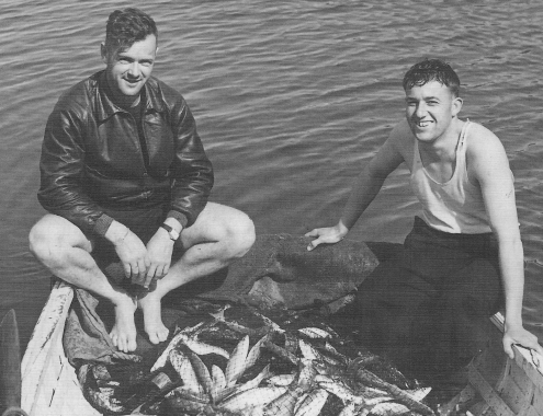 Two unidentified men with a remarkable fishing haul on Great Barrier Island, early 1900s. Can you identify them? Email editor@aoteagbi.news Photo / Supplied