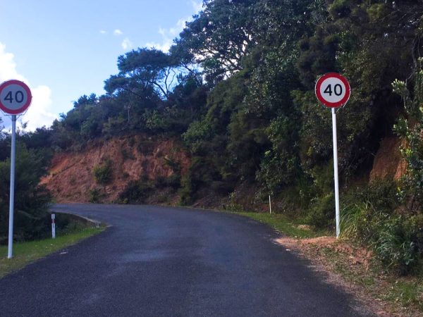 New speed limit signs on Great Barrier Island spark debate—are they safety measures or just another sign of the city's trappings creeping in?