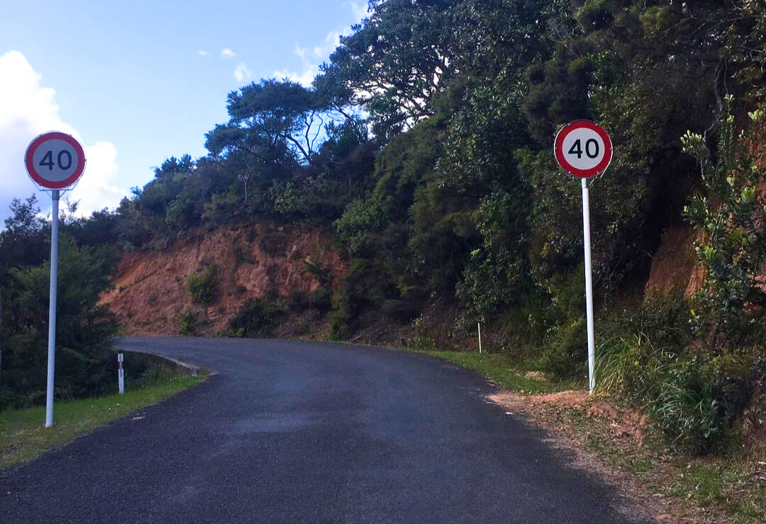 New speed limit signs on Great Barrier Island spark debate—are they safety measures or just another sign of the city's trappings creeping in?