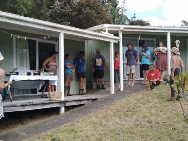 Aotea Army in action: Volunteers from the community work together during a working bee day at Kate Langford's home, demonstrating the power of collective effort in transforming and beautifying local spaces.