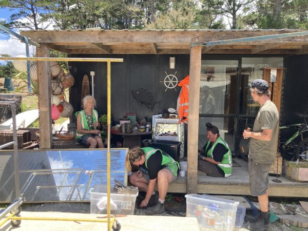 Community Strength in Action: Volunteers unite for a clean-up day at Anamata, restoring hope and order after the unexpected fire.