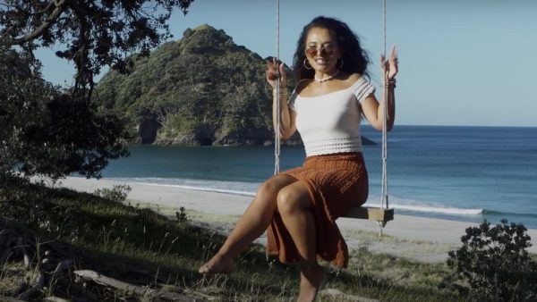 Waii in her element — against the wild, open backdrop of Great Barrier Island, where Bumble Bee feels right at home. Photo / Waii Music
