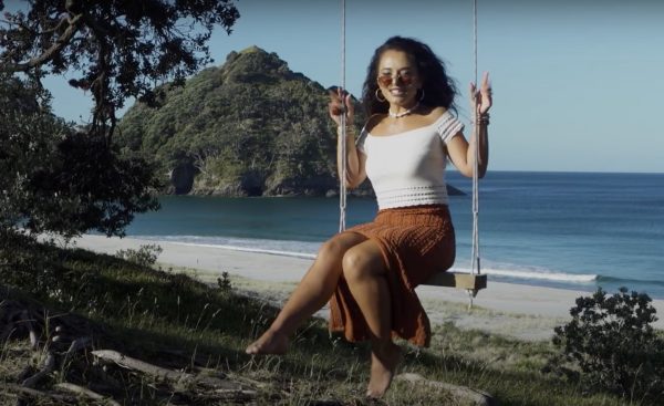 Waii in her element — against the wild, open backdrop of Great Barrier Island, where Bumble Bee feels right at home. Photo / Waii Music