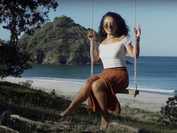 Waii in her element — against the wild, open backdrop of Great Barrier Island, where Bumble Bee feels right at home. Photo / Waii Music