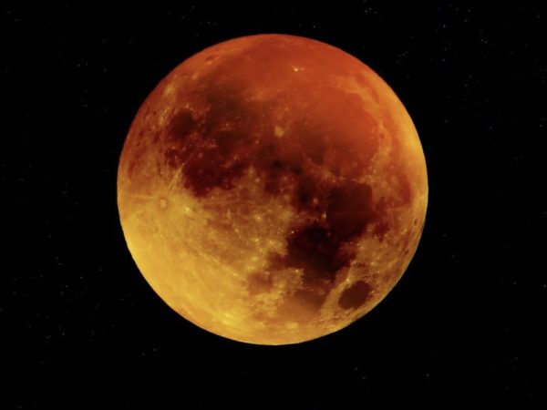 Blood moon as dark skies reveal the total lunar eclipse.