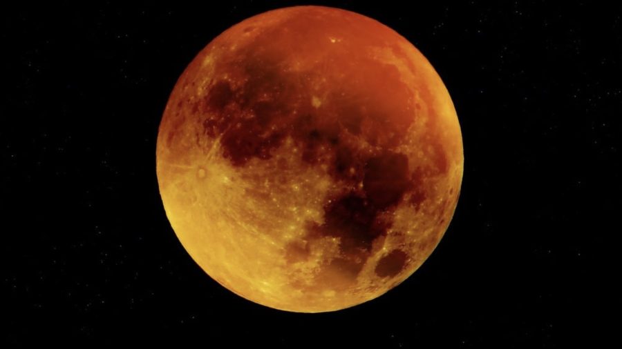 Blood moon as dark skies reveal the total lunar eclipse.