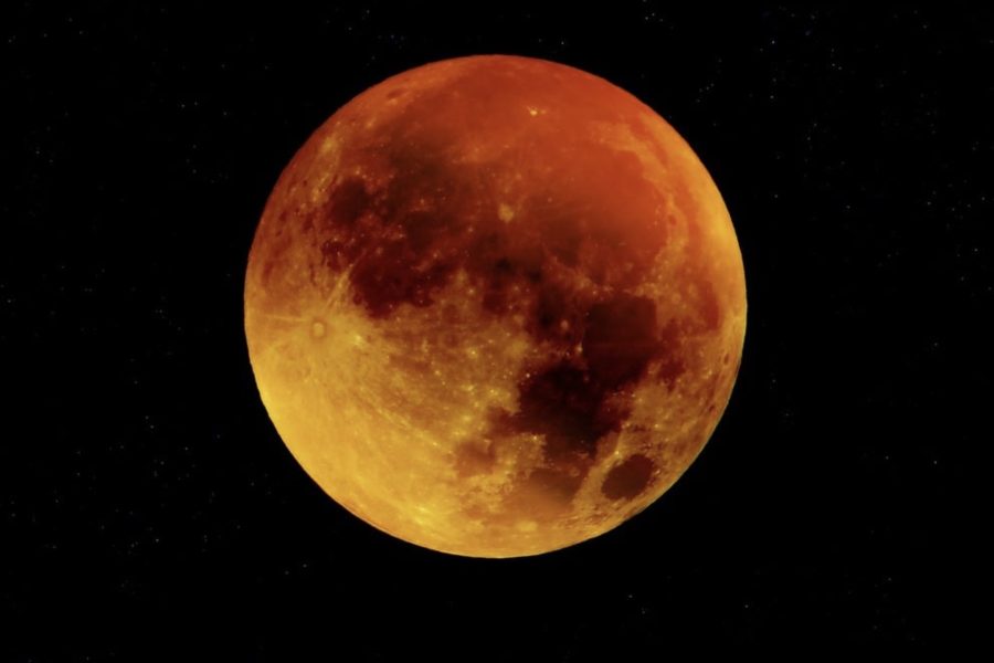 Blood moon as dark skies reveal the total lunar eclipse.