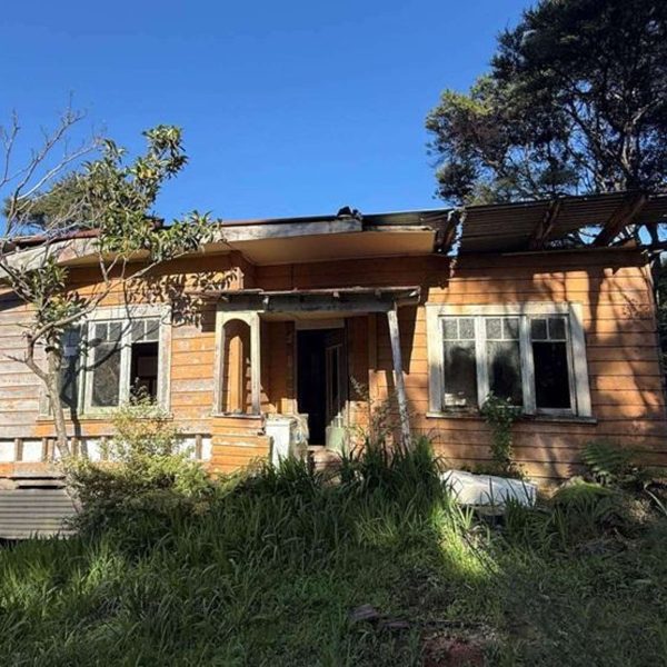 Weathered timber and rusting iron cling to what’s left of the old pioneer cottage on Blind Bay Road — soon to perhaps make way for a new build.