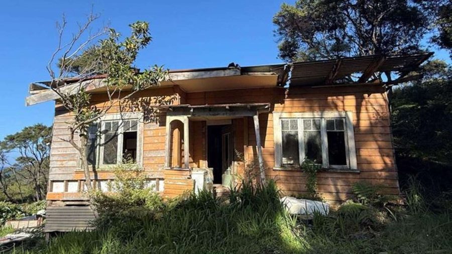 Weathered timber and rusting iron cling to what’s left of the old pioneer cottage on Blind Bay Road — soon to perhaps make way for a new build.