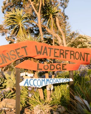Sunset Waterfront Lodge sits opposite the beach at Mulberry Grove, a familiar landmark for visitors arriving in Tryphena.