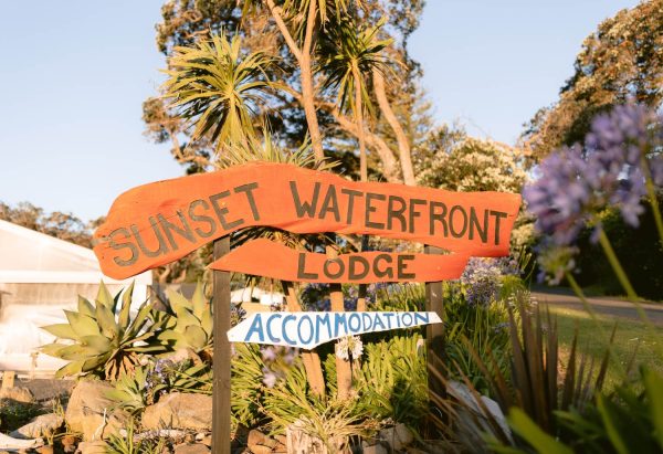 Sunset Waterfront Lodge sits opposite the beach at Mulberry Grove, a familiar landmark for visitors arriving in Tryphena.