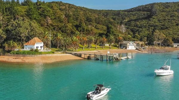 The RNZYS property at Bon Accord Harbour, Kawau Island — including the historic Lidgard House (left) — is set to be sold, despite opposition from some members.