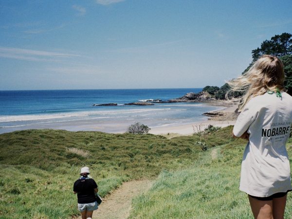 “Taking in the view: a retreat attendee pauses on the Barrier, soaking up the island’s off-grid inspiration.”