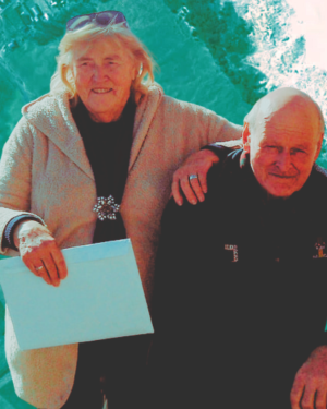 Composite image of Charlie and Winnie Blackwell above the Kaitoke flats on Great Barrier Island, showing the mānuka scrub and swamp area at the centre of the Council’s investigation.